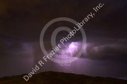 Lightning strikes during a thunderstorm on the first day of summer in Boise, Idaho, USA.