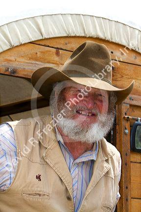 Muleskinner riding on a covered wagon at the City of Rocks National Reserve and state park in Cassia County, Idaho, USA. MR