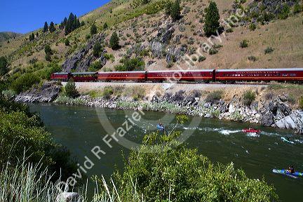 The Thunder Mountain Line scenic tourist train traveling along the Payette River between Horseshoe Bend and Banks, Idaho, USA.