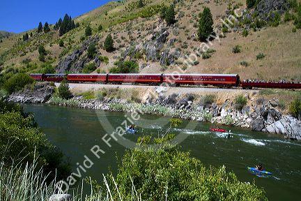 The Thunder Mountain Line scenic tourist train traveling along the Payette River between Horseshoe Bend and Banks, Idaho, USA.