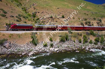 The Thunder Mountain Line scenic tourist train traveling along the Payette River between Horseshoe Bend and Banks, Idaho, USA.