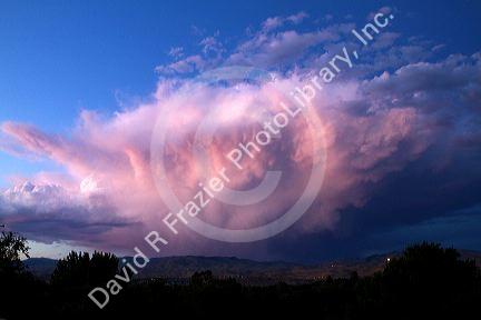 Summer storm cloud at sunset over the foothills near Boise, Idaho, USA.