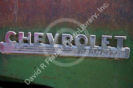 Logo for a Chevrolet Loadmaster at an automobile wrecking yard near Caldwell, Idaho, USA.