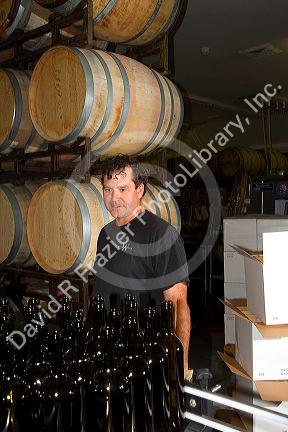 Winemaker tasting red wine at Woodriver Cellars in Eagle, Idaho, USA.