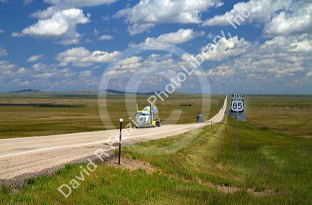 Semi truck traveling on highway 85 north of Spearfish, South Dakota, USA.