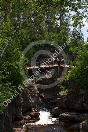 Waterfall and footbridge on the Temperance River near Tofte in northern Minnesota, USA.