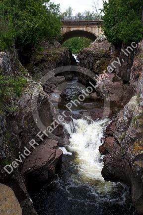 Waterfall and footbridge on the Temperance River near Tofte in northern Minnesota, USA.