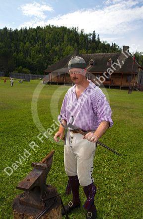 Blacksmith participate in a rendezvous re-enactment at the Grand Portage National Monument on the north shore of Lake Superior in northeastern Minnesota, USA.