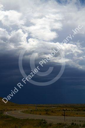 Storm clouds and highway near Green River, Wyoming, USA.
