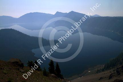 Crater Lake shrouded in smoke from forest fires in Crater Lake National Park located in southern Oregon, USA.