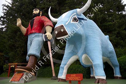 Paul Bunyan and Babe the Blue Ox statues at Trees of Mystery, a roadside attraction located in Klamath, California, USA.