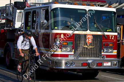 San Francisco Fire Department ladder truck driving in San Francisco, California, USA.