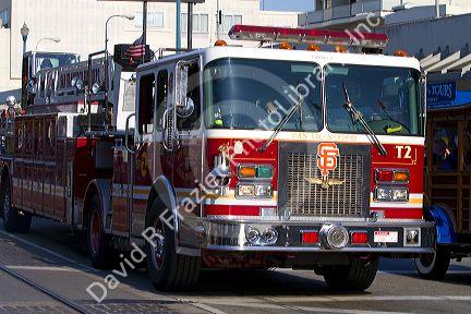 San Francisco Fire Department ladder truck driving in San Francisco, California, USA.