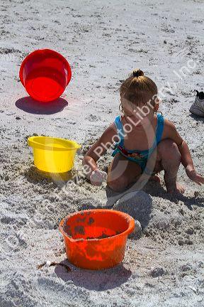Four year girl playing at Madeira Beach in Pinellas County, Florida, USA.