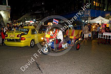 Auto rickshaw or a tuk-tuk on the street in Bangkok, Thailand.