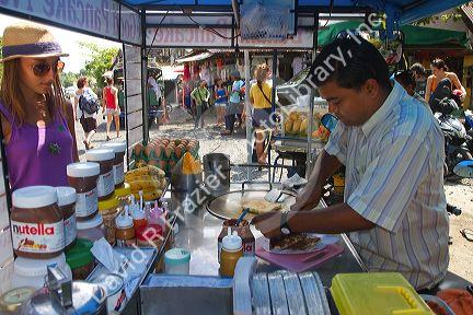 Street food vendors selling flavored pankakes at Chaweng beach village on the island of Ko Samui, Thailand.