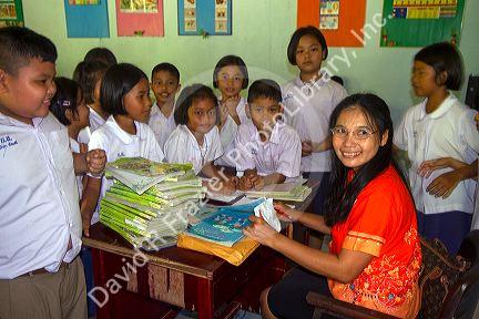 Teacher and students at a Thai elementary school on the island of Ko Samui, Thailand.