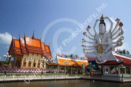 18 arm Buddha statue at Wat Plai Laem temple located on the island of Ko Samui, Thailand.