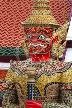 Buddhist mythology yaksa guarding the Temple of the Emerald Buddha located within the precincts of the Grand Palace, Bangkok, Thailand.