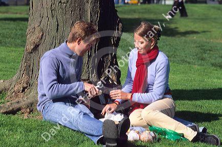 A couple having a picnic in Paris, France.