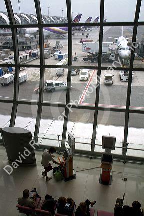 Departure gate and waiting area in the terminal at the Suvarnabhumi Airport also known as the New Bangkok International Airport in Bangkok, Thailand.