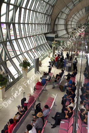 Departure gate and waiting area in the terminal at the Suvarnabhumi Airport also known as the New Bangkok International Airport in Bangkok, Thailand.