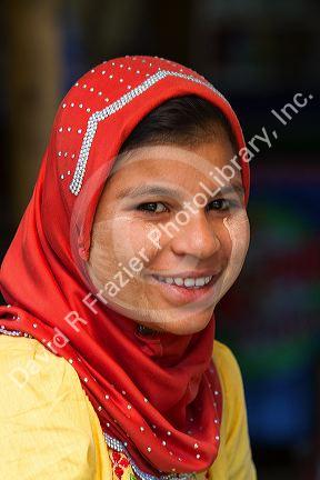 Portrait of a Burmese girl wearing thanaka on her cheeks in (Rangoon) Yangon, (Burma) Myanmar.