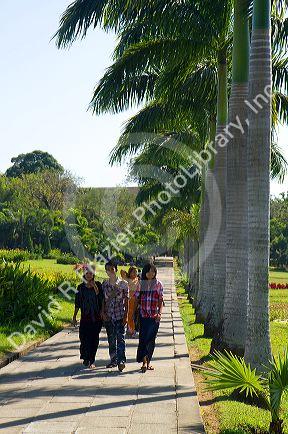 People walk along Inya Lake in (Rangoon) Yangon, (Burma) Myanmar.