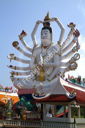 18 arm Buddha statue at Wat Plai Laem temple located on the island of Ko Samui, Thailand.