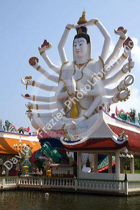 18 arm Buddha statue at Wat Plai Laem temple located on the island of Ko Samui, Thailand.