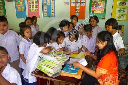 Teacher and students at a Thai elementary school on the island of Ko Samui, Thailand.
