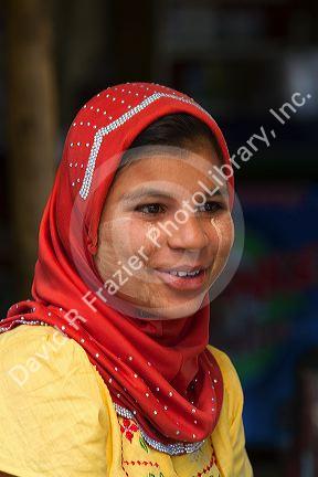 Portrait of a Burmese girl wearing thanaka on her cheeks in (Rangoon) Yangon, (Burma) Myanmar.