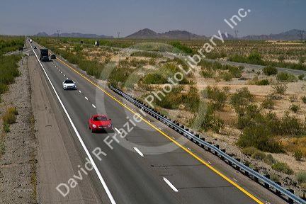 Vehicles travel on Interstate 10 west of Phoenix, Arizona, USA.