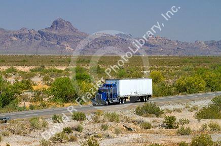 Freight transport truck traveling on Interstate 10 near Tucson, Arizona, USA.