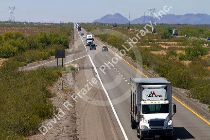 Vehicles travel on Interstate 10 west of Phoenix, Arizona, USA.