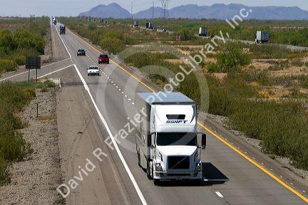 Freight transport truck traveling on Interstate 10 west of Phoenix, Arizona, USA.