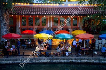 Colorful umbrellas at the Casa Rio restaurant along the River Walk in San Antonio, Texas, USA.