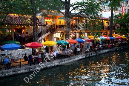 Colorful umbrellas at the Casa Rio restaurant along the River Walk in San Antonio, Texas, USA.
