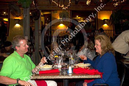 Outdoor dining along the River Walk in San Antonio, Texas, USA.