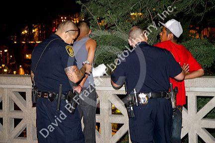 Police arrest suspects along the River Walk in San Antonio, Texas, USA.