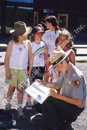 A ranger with children in Yellowstone National Park, Wyoming.