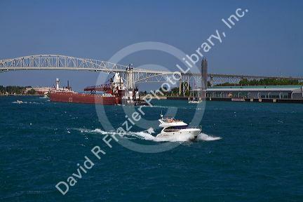 The Blue Water Bridge spanning the St. Clair River connects Port Huron, Michigan with Sarnia, Ontario, Canada.