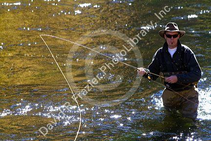 Angler fly fishing on the South Fork of the Boise River in Elmore County, Idaho, USA.
