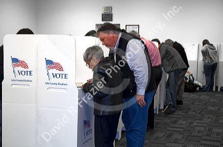 People vote in cardboard voting booths at a polling station in Boise, Idaho, USA.