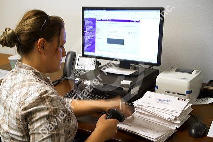 Election worker recording absentee ballots in Boise, Idaho, USA.