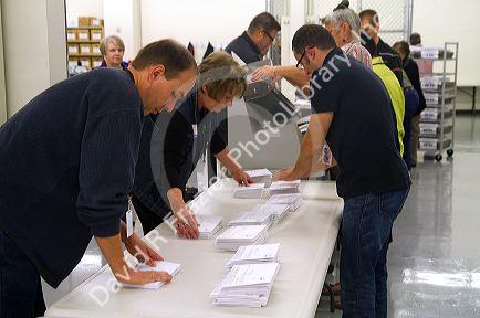 Election workers receiving absentee voter ballots in envelopes at the Ada County Elections building in Boise, Idaho, USA.