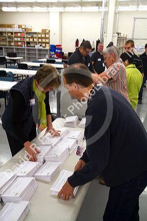 Election workers receiving absentee voter ballots in envelopes at the Ada County Elections building in Boise, Idaho, USA.