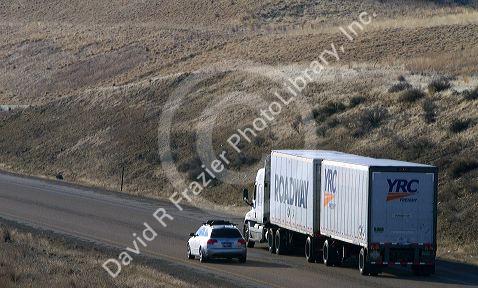 Semi truck hauling a double trailer on Interstate 84 near Boise, Idaho, USA.