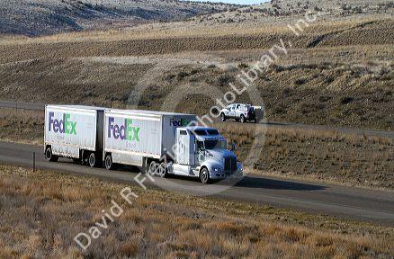 Semi truck hauling a double trailer on Interstate 84 near Boise, Idaho, USA.