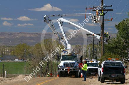 Idaho Power installing electric power lines using cherry pickers near Boise, Idaho, USA.